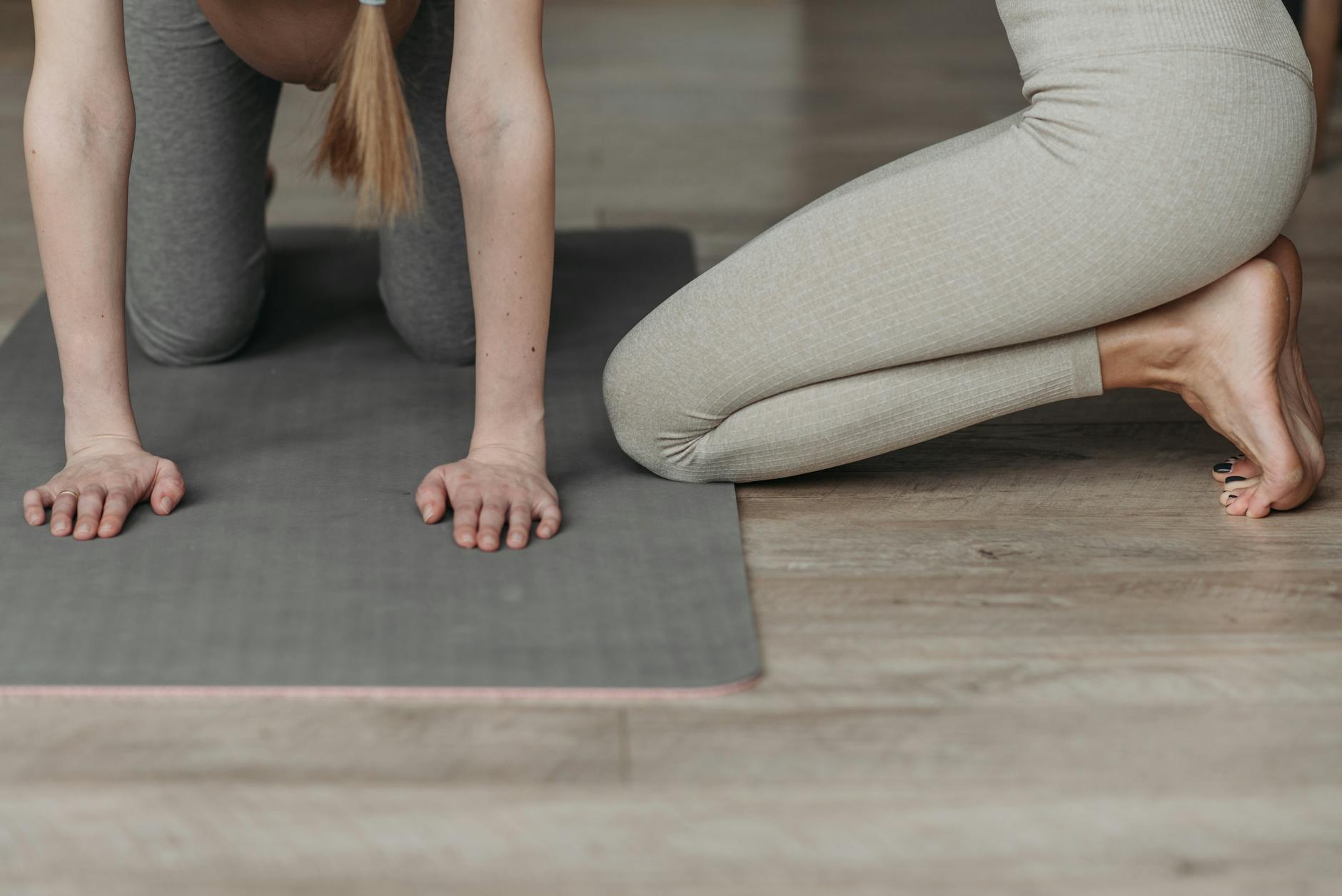 a pregnant woman exercising with guidance