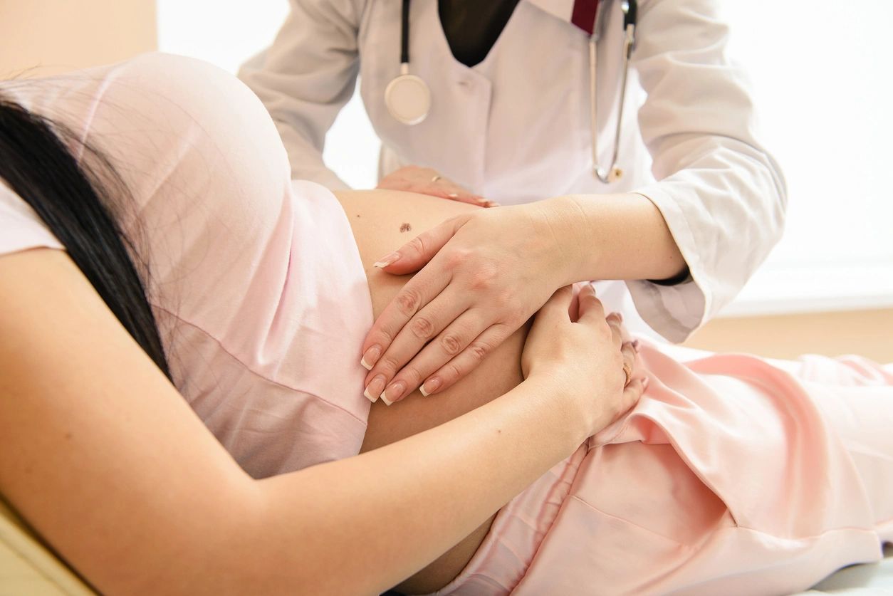 pregnant woman and nurse completing assessment